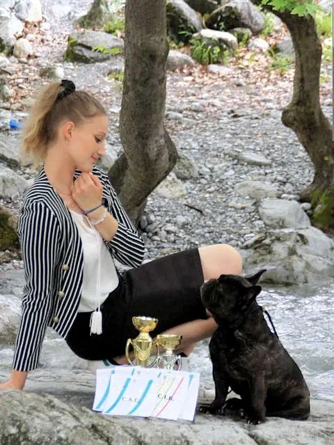 Veronica Tilkeridou relaxing with dog show winner